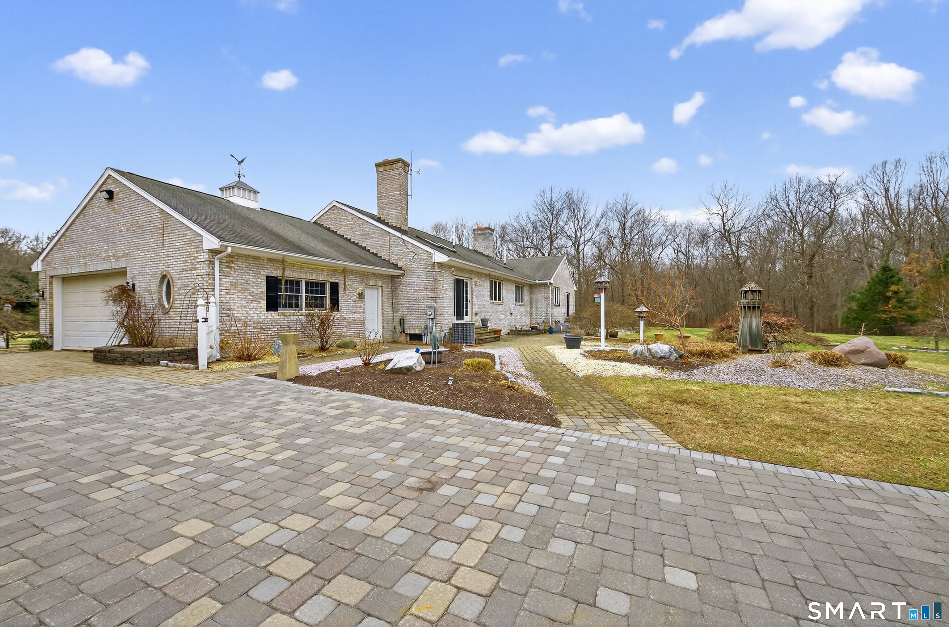 724 Strong Road South Windsor, CT 06074 - Photo 29 of 39 a view of a white house with a yard and swimming pool