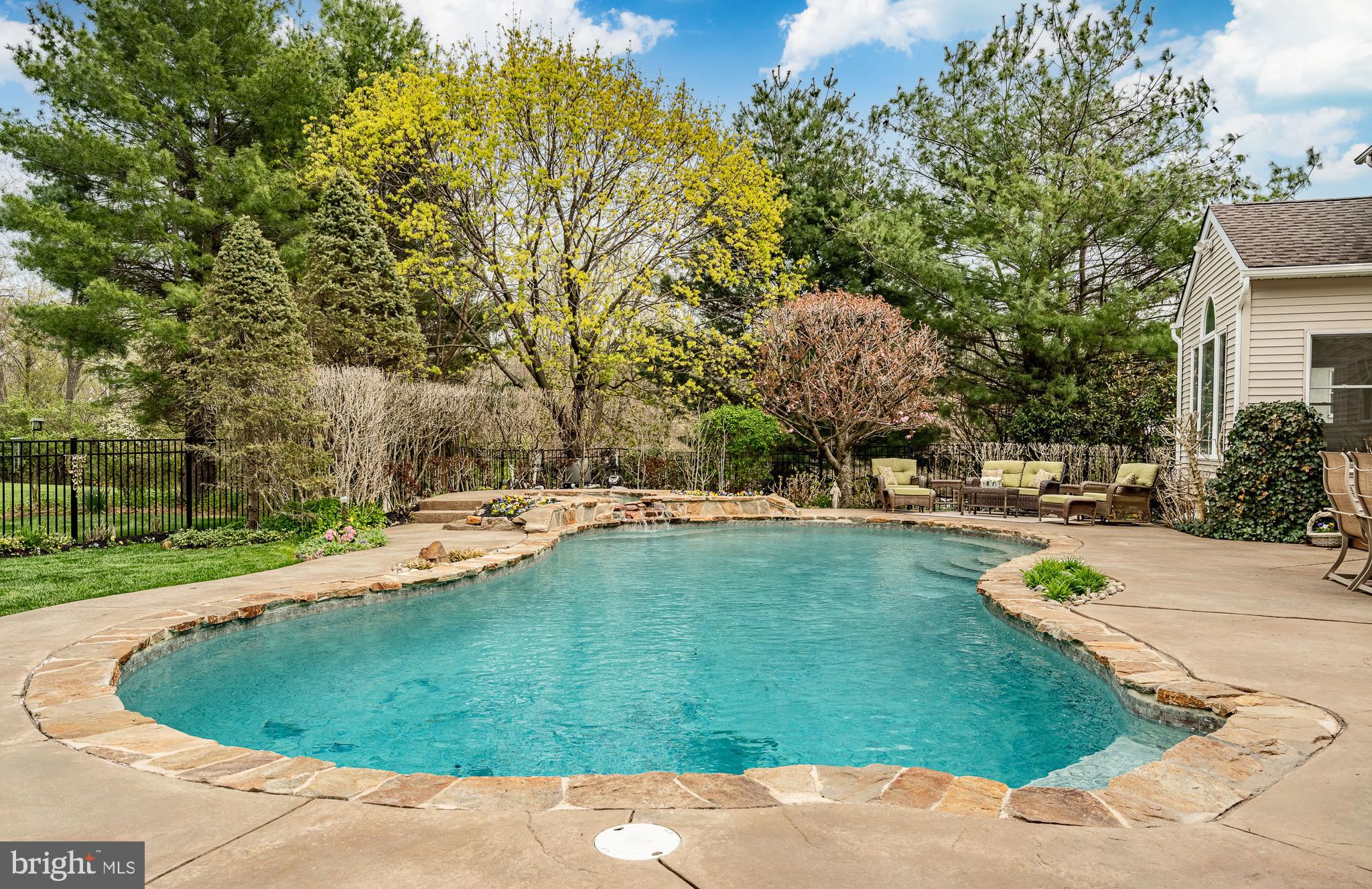 5 Country Run Thornton, PA 19373 - Photo 36 of 50 a view of a swimming pool with a patio