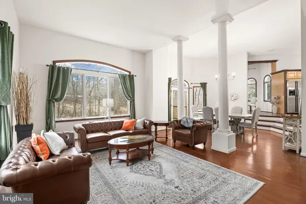 a view of a livingroom with furniture and a flat screen tv