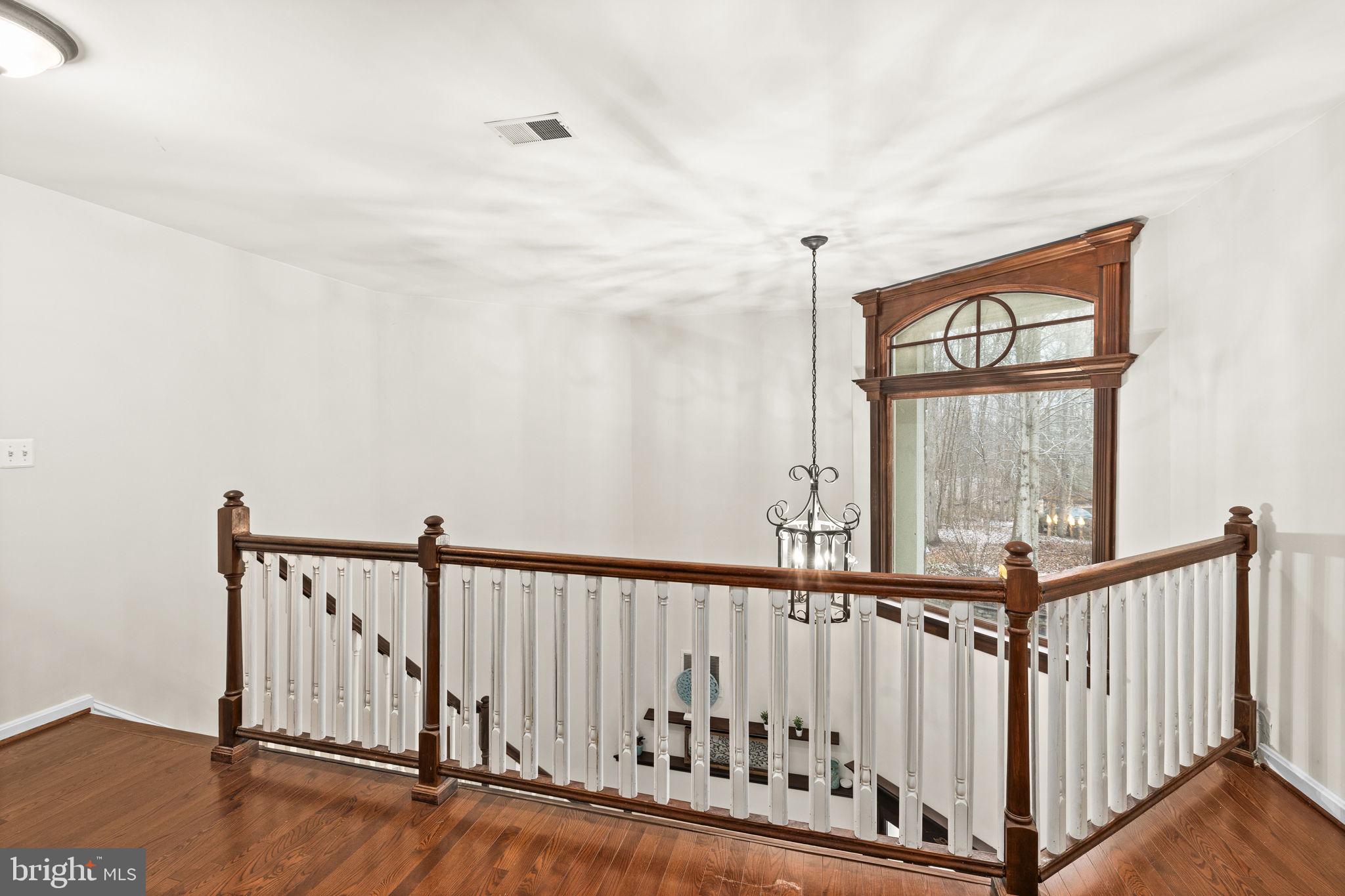 8701 Sinclair Mill Road Manassas, VA 20112 - Photo 46 of 130 a view of staircase with railing and a window
