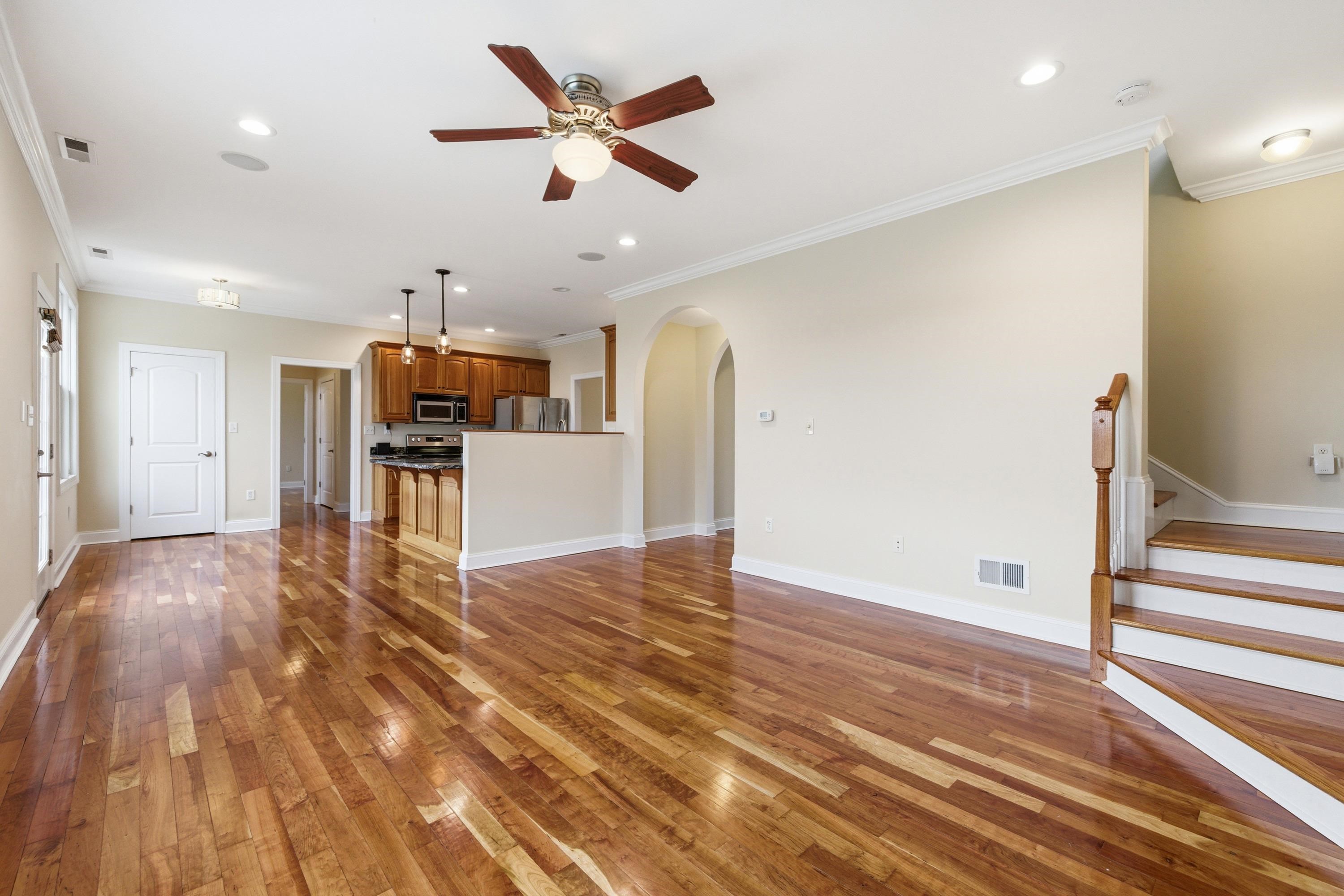 2625 Rising Rock Court Harrisonburg, VA 22802 - Photo 11 of 73 The living room space is large and offers hardwood flooring throughout, large windows allowing in an abundance of natural light, gas fireplace, and plenty of room for gathering with family and friends.