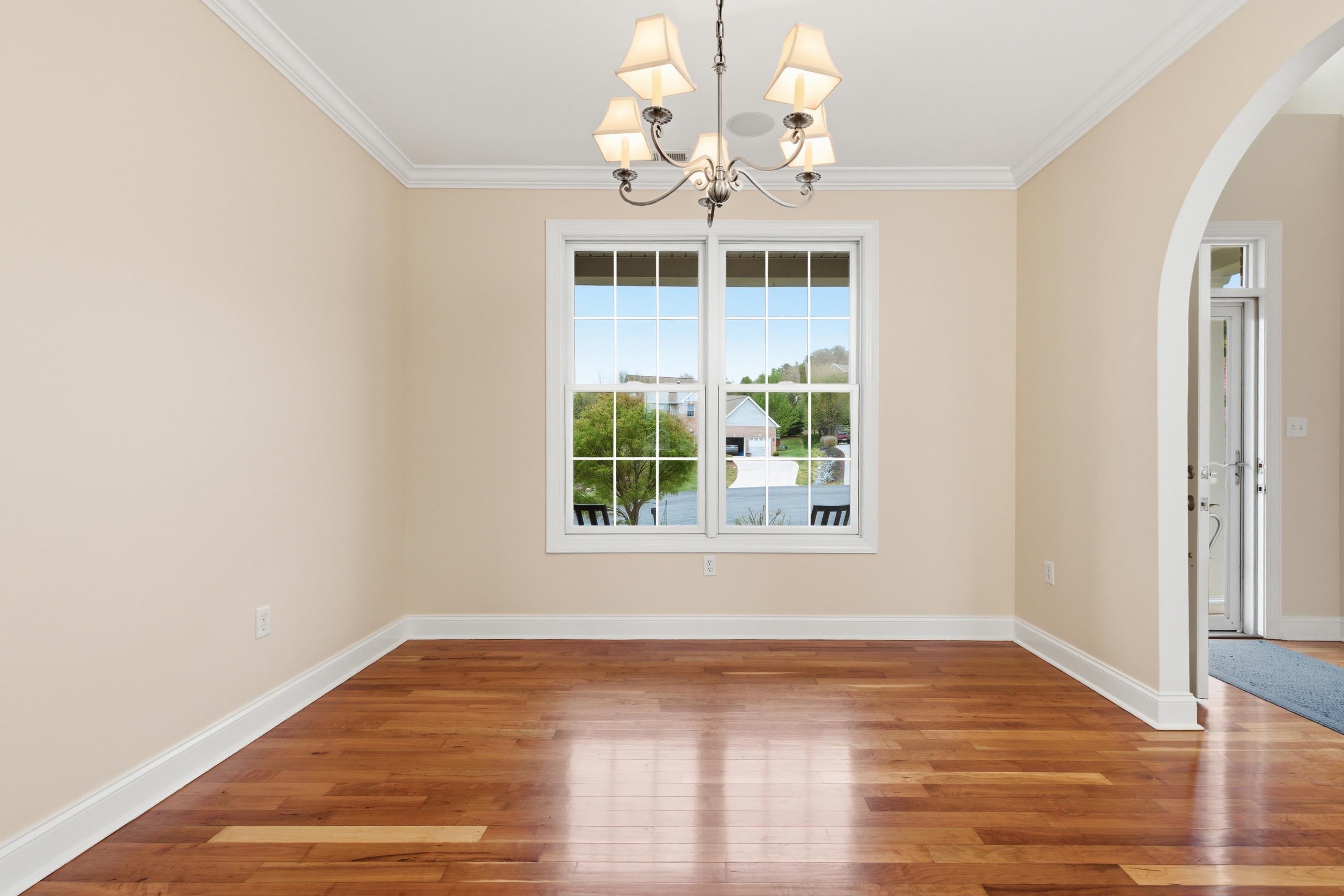 2625 Rising Rock Court Harrisonburg, VA 22802 - Photo 17 of 73 The dining room offers large windows throughout, chandelier, hardwood flooring throughout the space, and plenty of space for a table and chairs set.