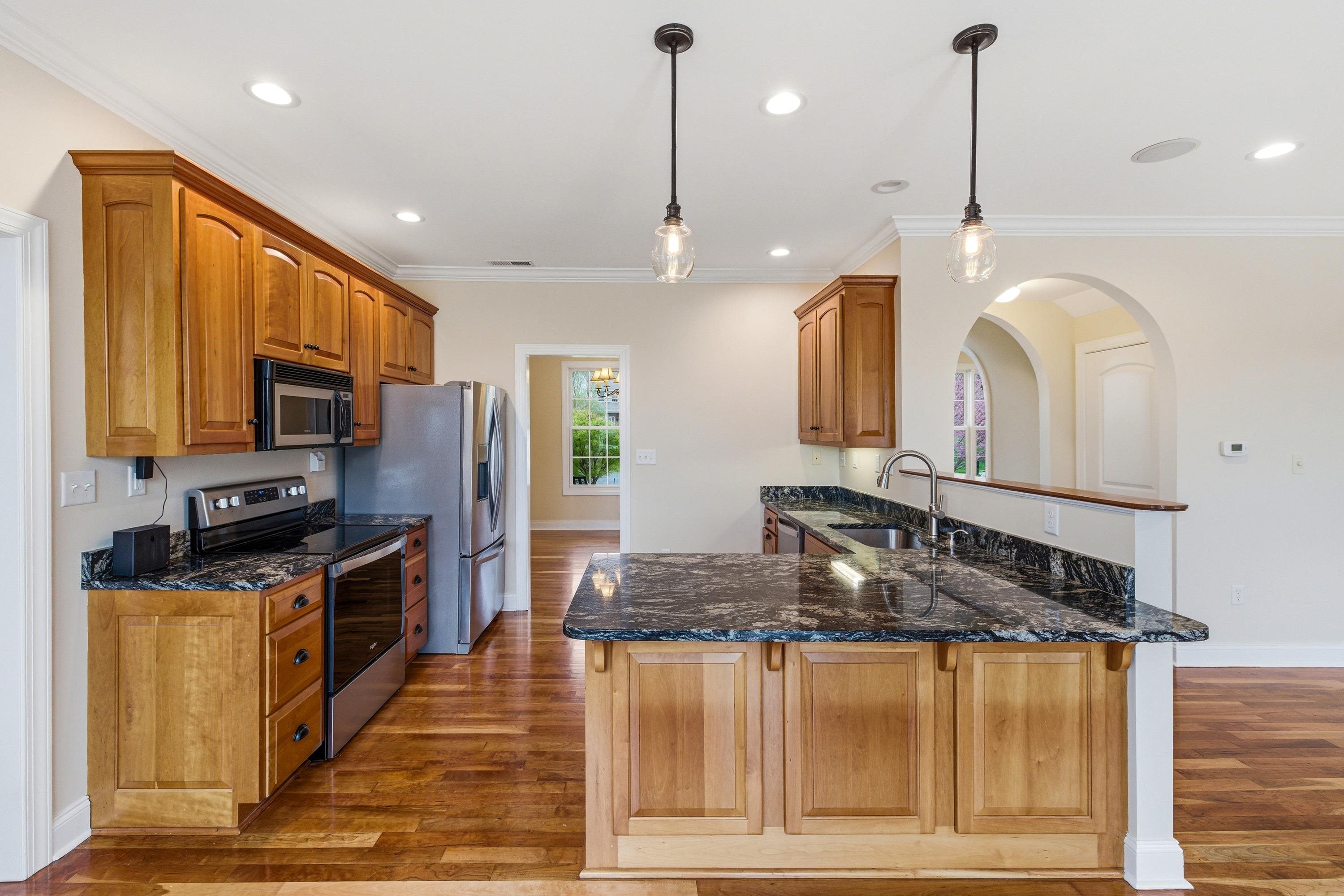 2625 Rising Rock Court Harrisonburg, VA 22802 - Photo 2 of 73 This lovely kitchen features hardwood flooring throughout, stainless steel appliances, recessed lighting, granite counter-tops, breakfast bar, and much more!