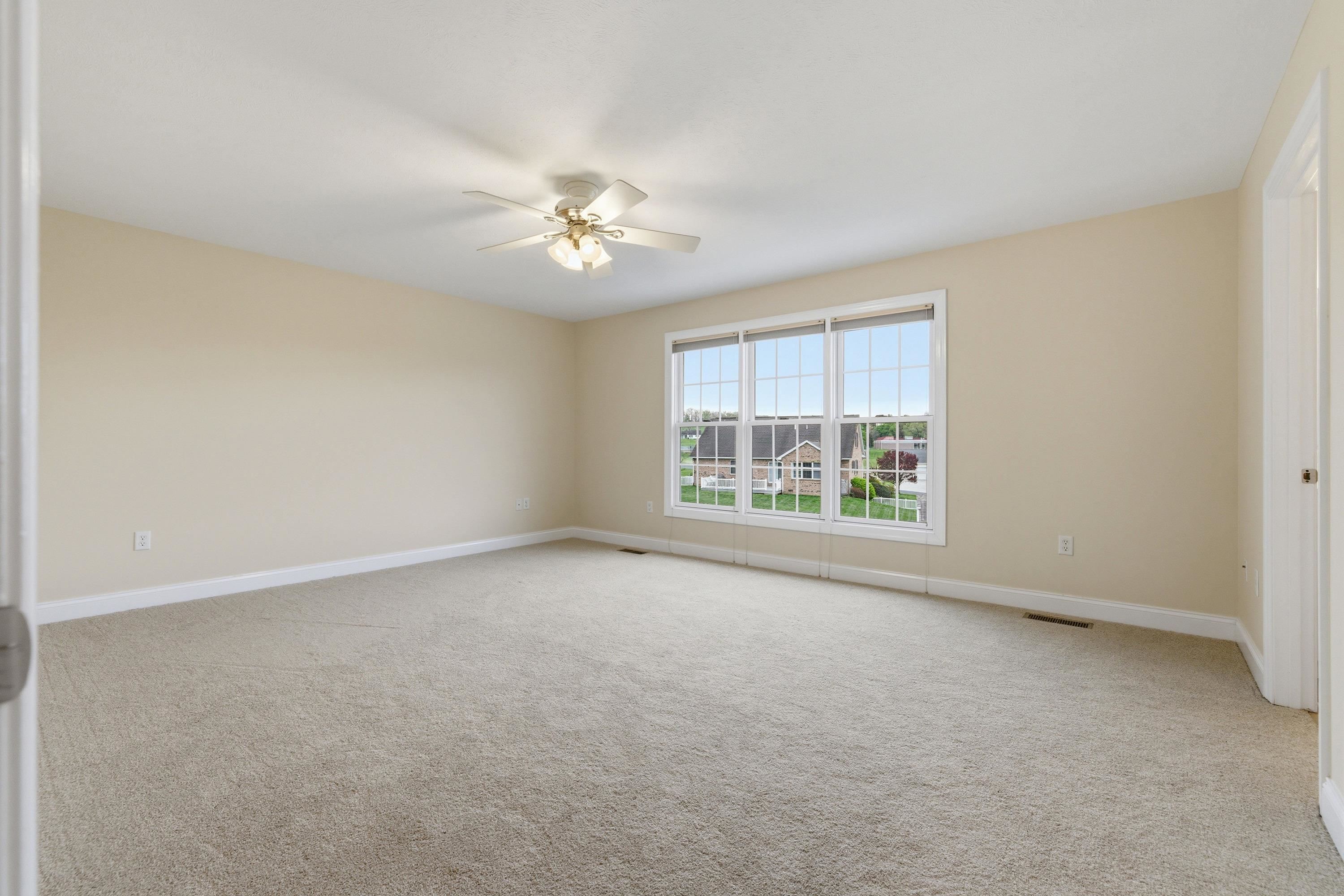 2625 Rising Rock Court Harrisonburg, VA 22802 - Photo 24 of 73 The primary bedroom is located on the upper level of the home and offers comfortable flooring throughout, ceiling fan, large windows, and spacious walk-in closet.