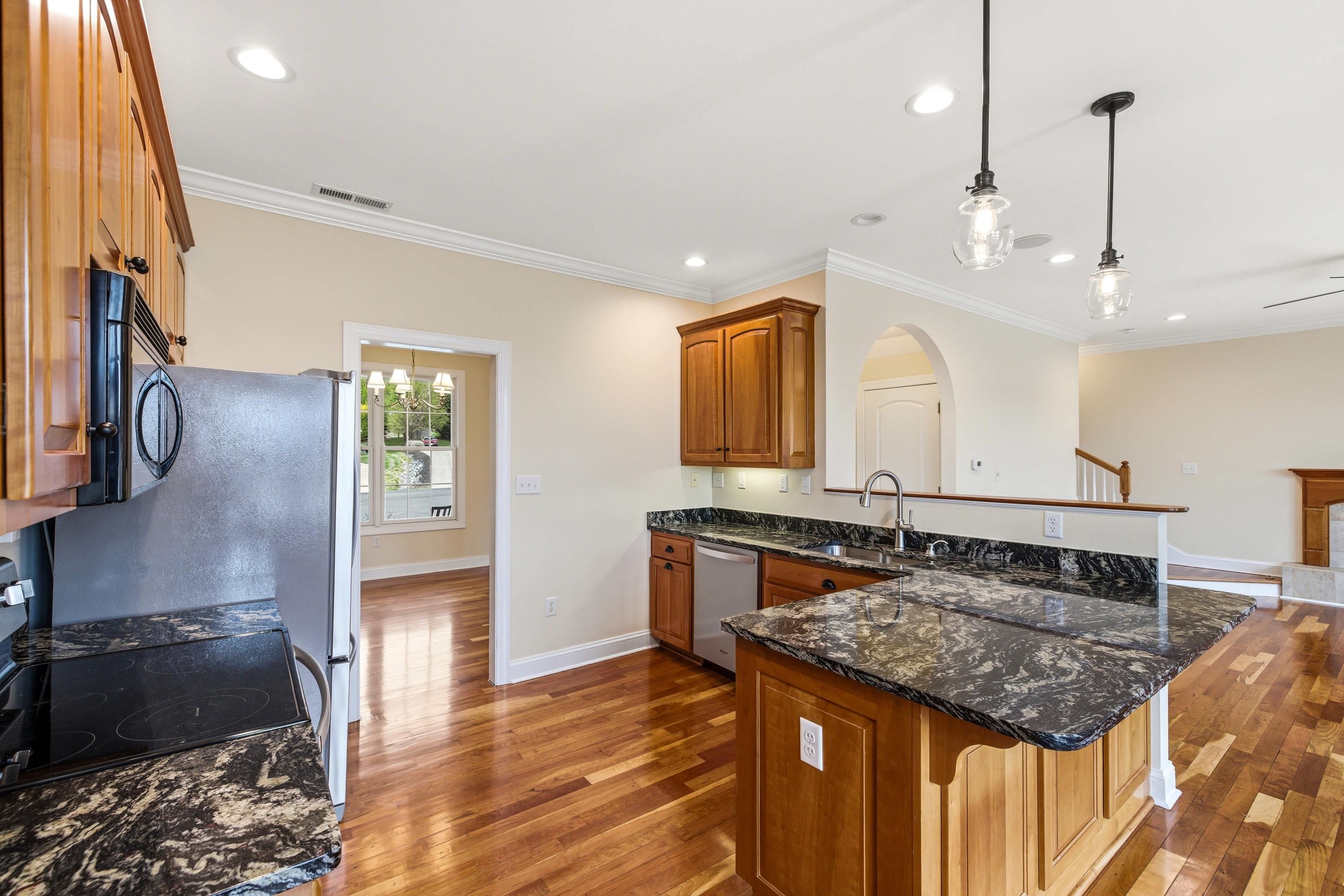 2625 Rising Rock Court Harrisonburg, VA 22802 - Photo 3 of 73 This lovely kitchen features hardwood flooring throughout, stainless steel appliances, recessed lighting, granite counter-tops, breakfast bar, and much more!