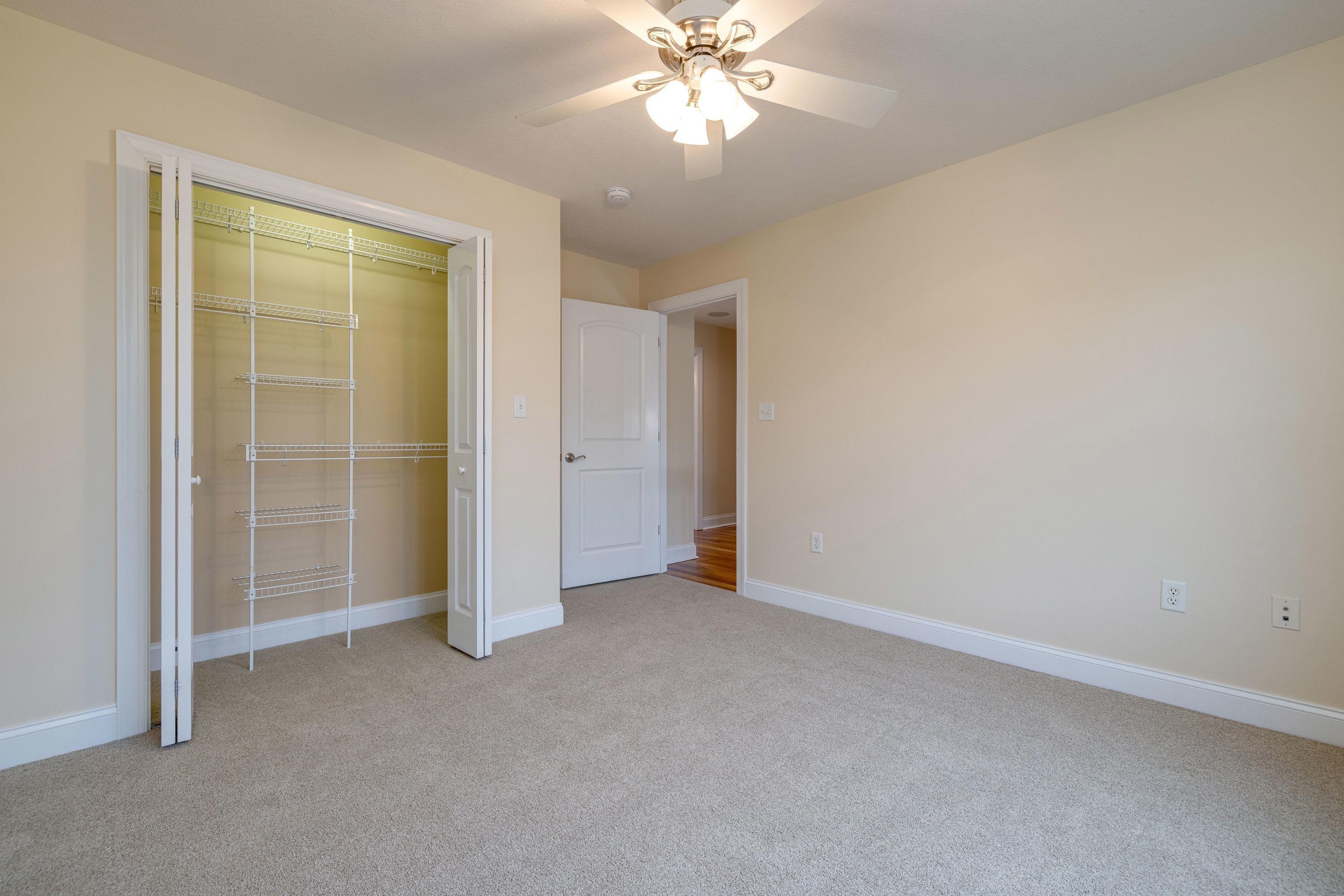 2625 Rising Rock Court Harrisonburg, VA 22802 - Photo 35 of 73 An additional bedroom on the upper level of the home, this bedroom features comfortable flooring throughout and a spacious closet with shelving!