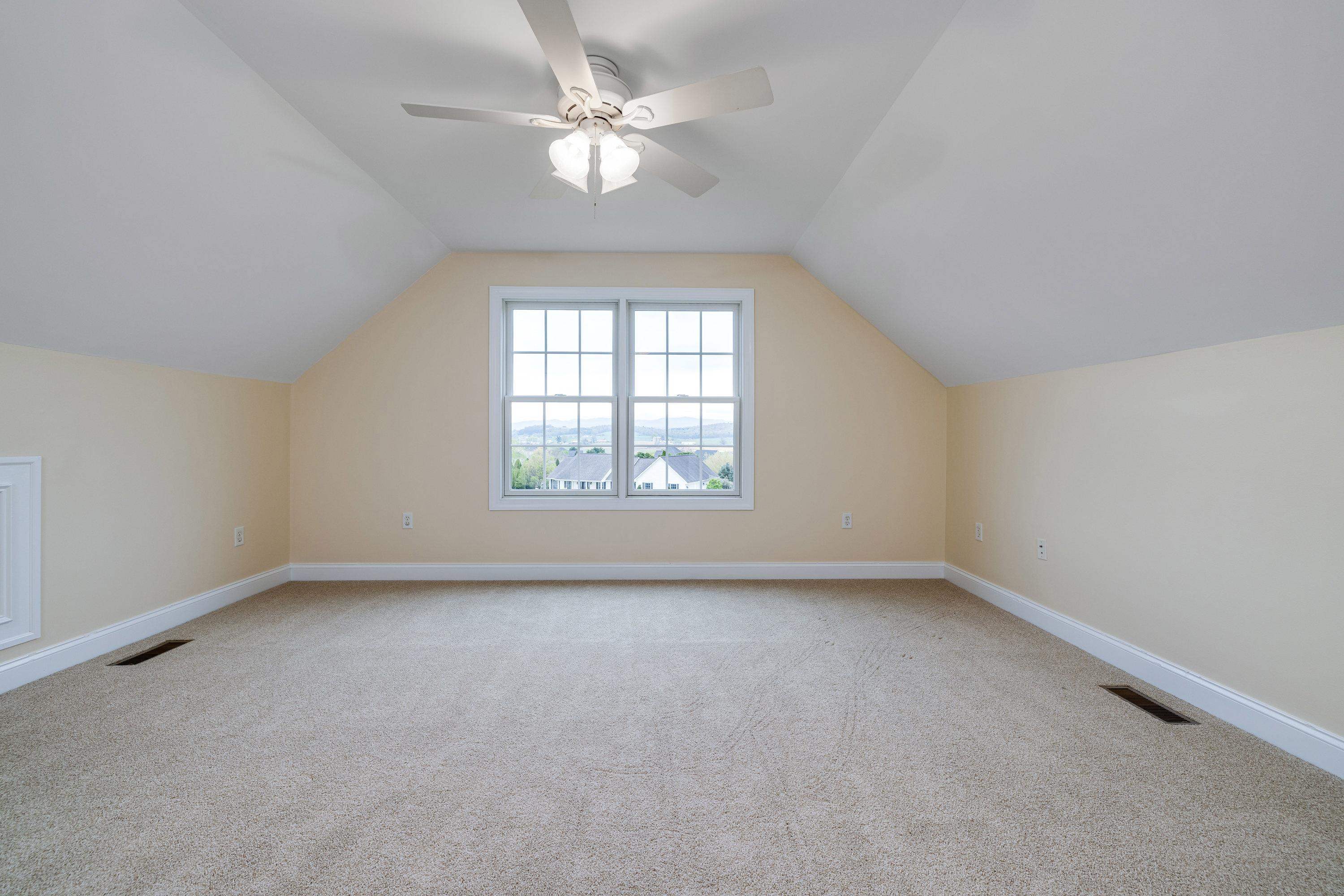 2625 Rising Rock Court Harrisonburg, VA 22802 - Photo 39 of 73 A very spacious bedroom is lcoated on the upper level over the garage space! This large bedroom features comfortable flooring throughout, ceiling fan, large closet, and more!