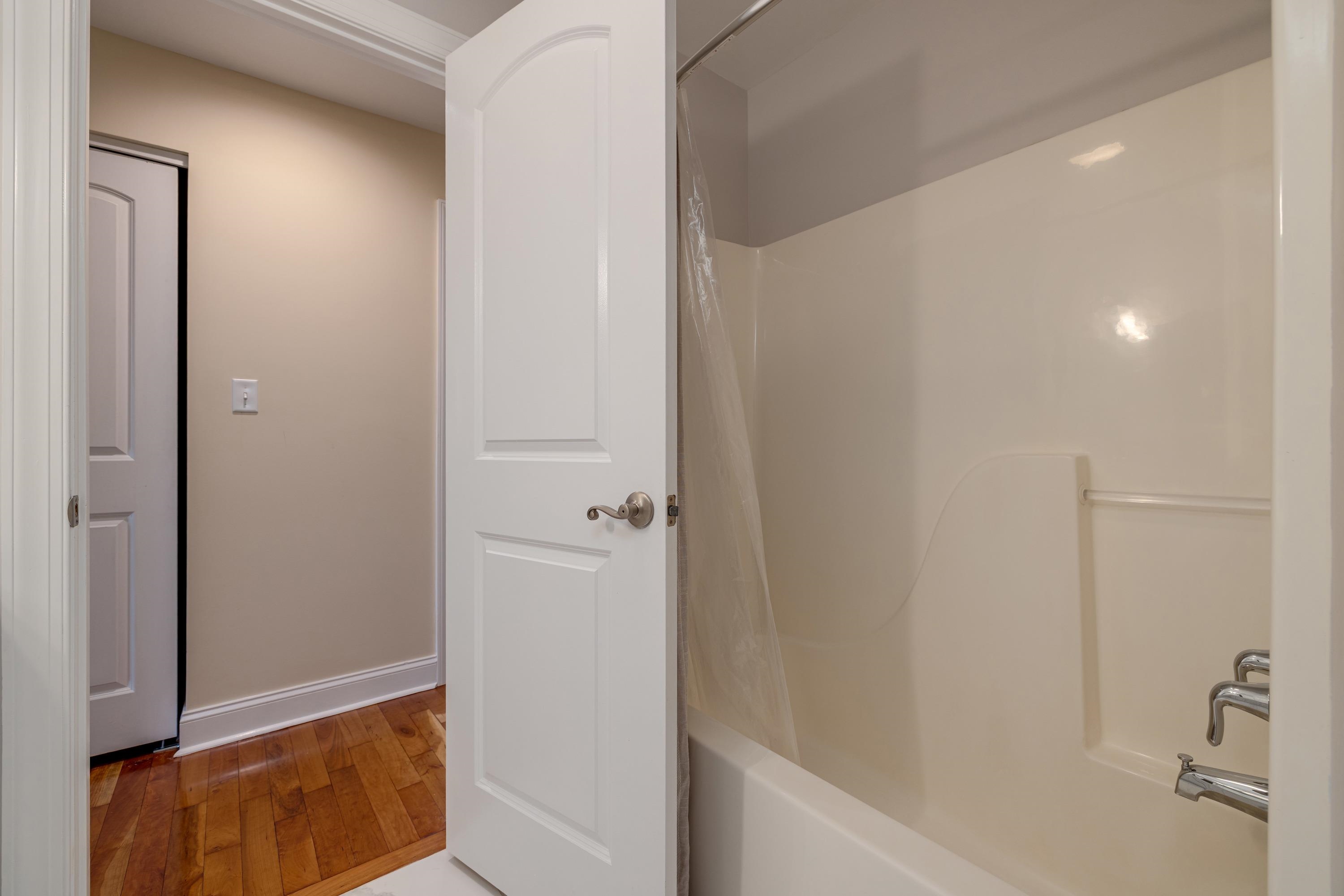 2625 Rising Rock Court Harrisonburg, VA 22802 - Photo 43 of 73 This full bathroom features a full bathtub/shower combination. This bedroom offers convenience to the upstairs bedrooms and offers tile flooring and vanity with storage.