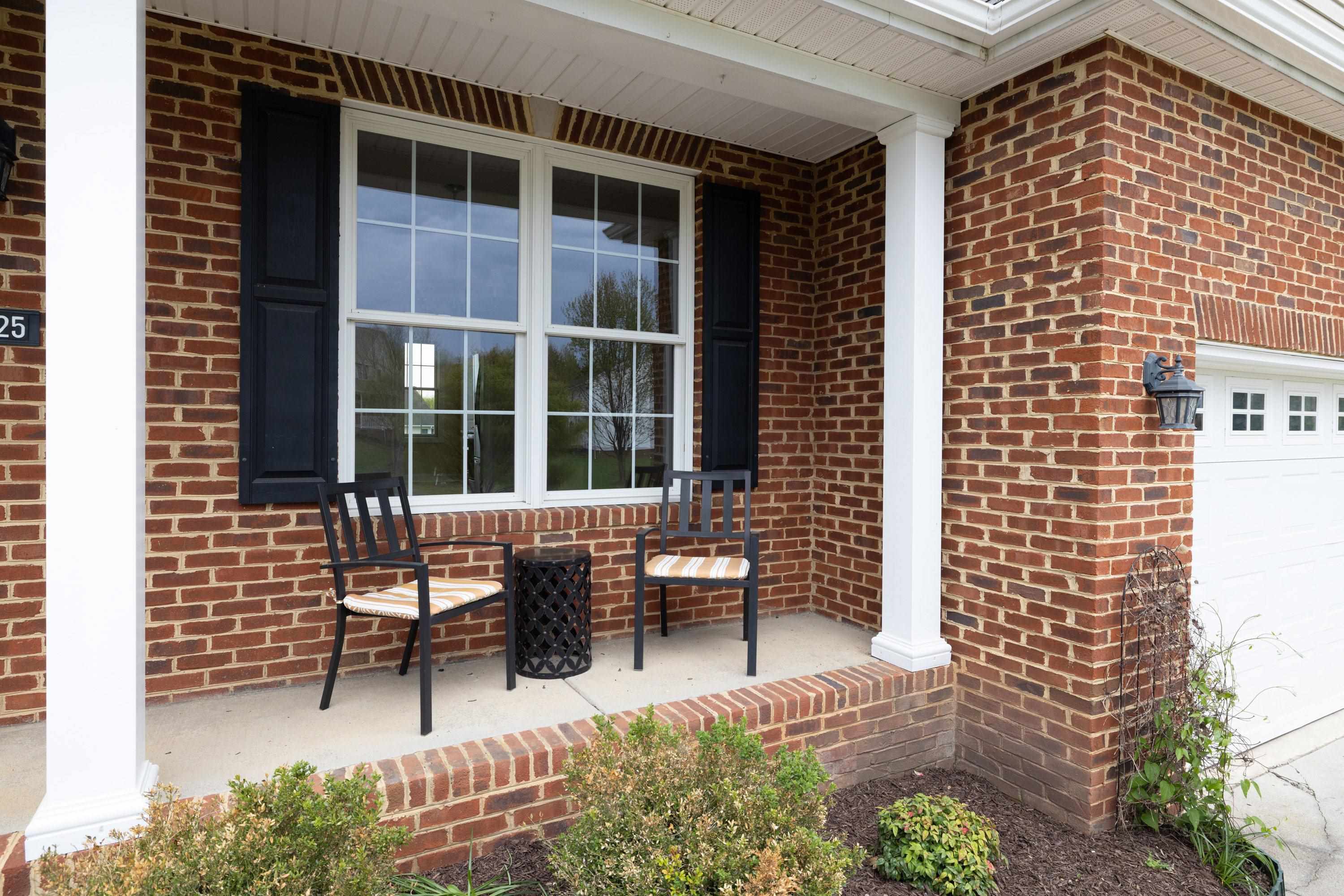 2625 Rising Rock Court Harrisonburg, VA 22802 - Photo 55 of 73 This front porch features space for a table and chairs set and highlights the brick exterior of the home.