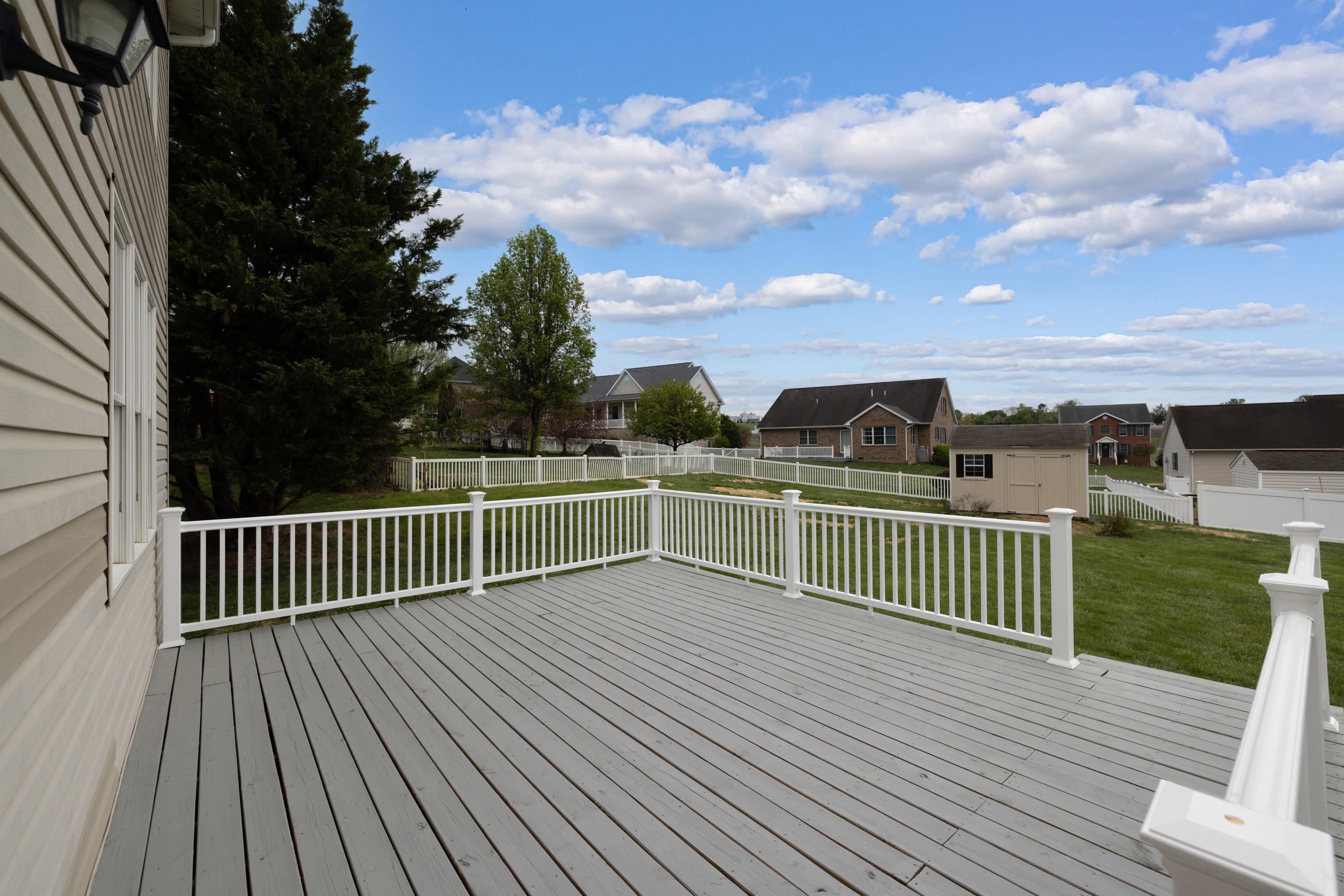 2625 Rising Rock Court Harrisonburg, VA 22802 - Photo 60 of 73 The very spacious deck is located off the rear of the home and patio doors in the kitchen area. This deck features vinyl railings.