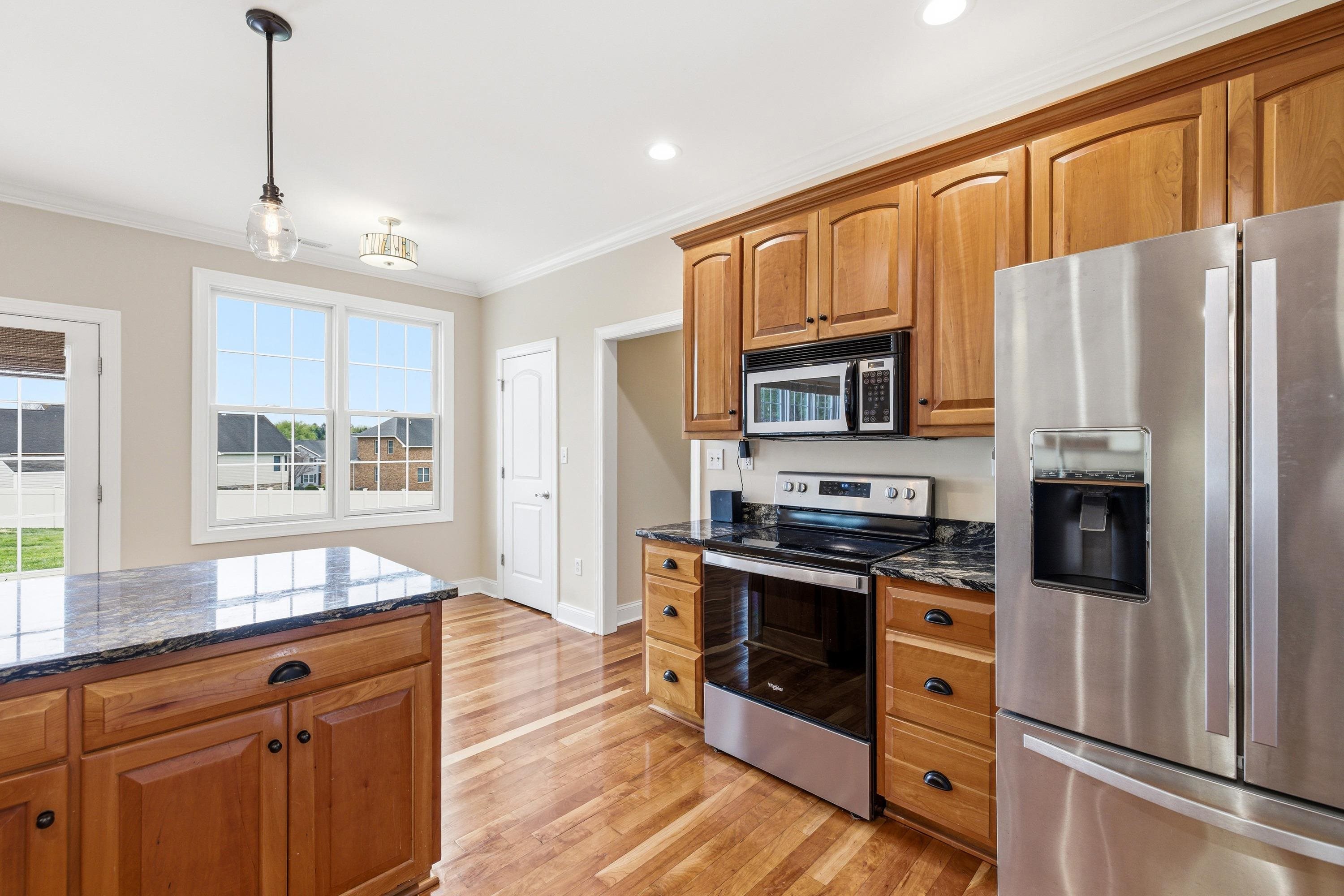 2625 Rising Rock Court Harrisonburg, VA 22802 - Photo 6 of 73 This lovely kitchen features hardwood flooring throughout, stainless steel appliances, recessed lighting, granite counter-tops, breakfast bar, and much more!