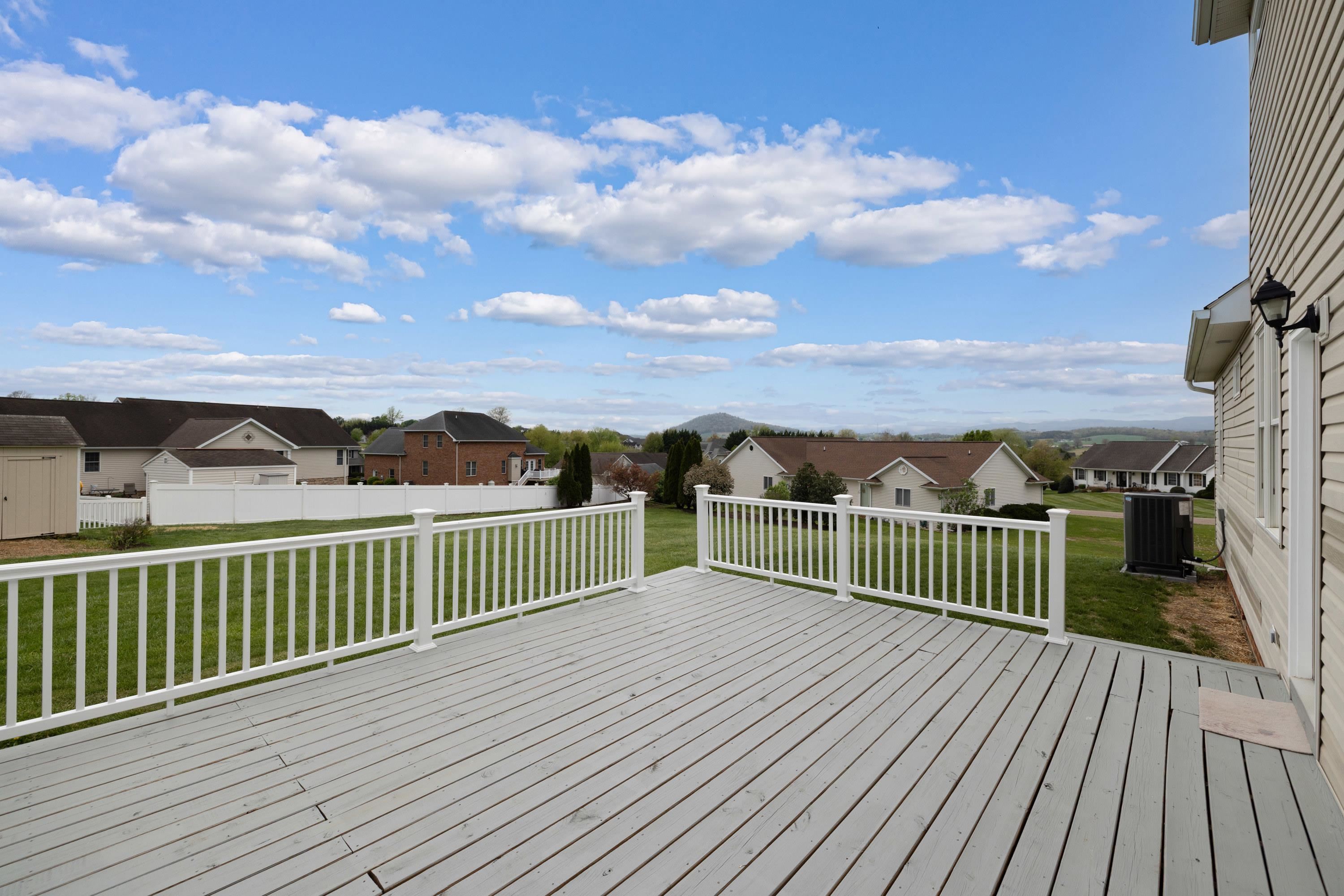 2625 Rising Rock Court Harrisonburg, VA 22802 - Photo 61 of 73 The very spacious deck is located off the rear of the home and patio doors in the kitchen area. This deck features vinyl railings.
