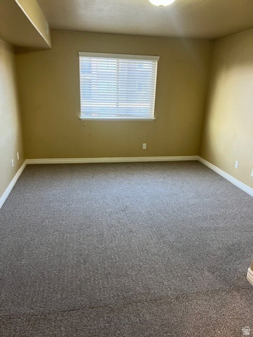 917 South Main Street, Unit H Layton, UT 84041 - Photo 12 of 19 Carpeted empty room with baseboards