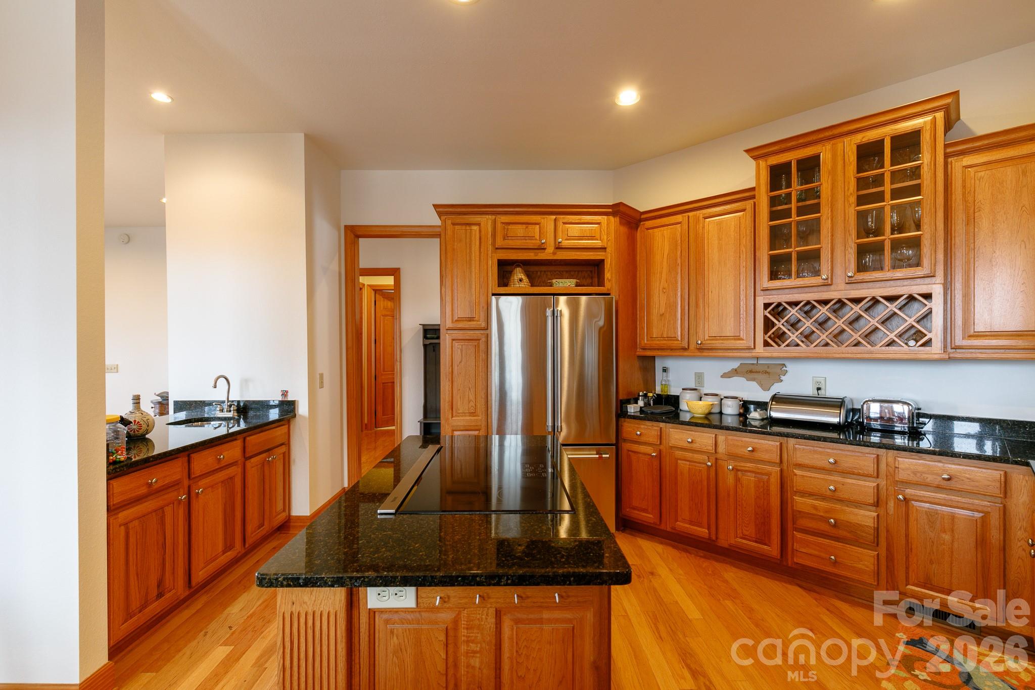 528 Andrew Banks Road, Unit A/3 Burnsville, NC 28714 - Photo 11 of 30 a kitchen with stainless steel appliances granite countertop a stove a sink and a microwave