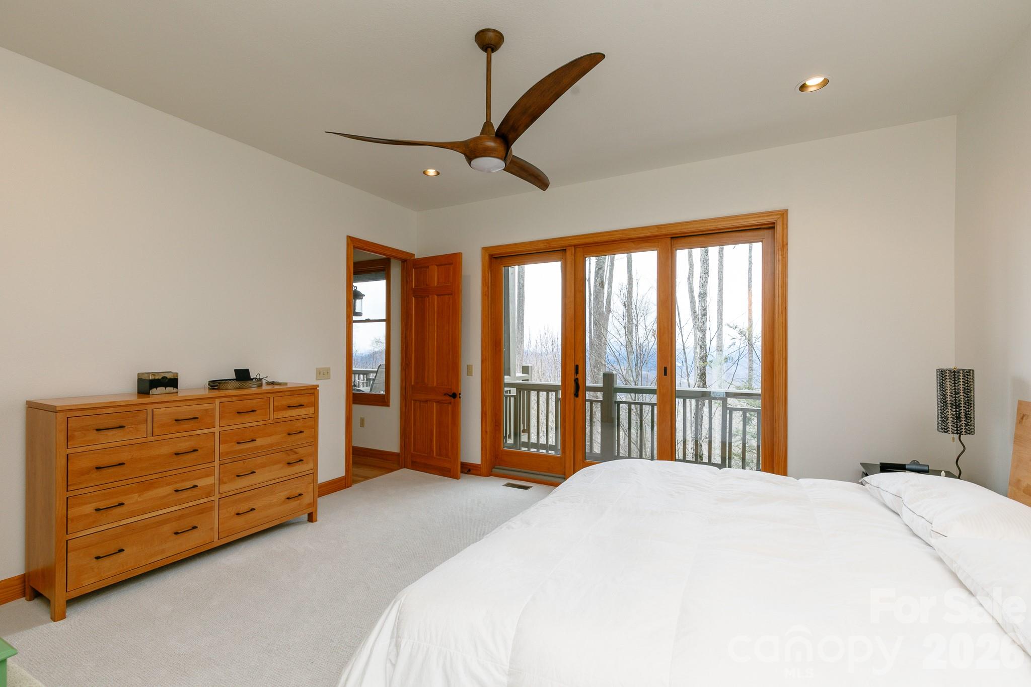 528 Andrew Banks Road, Unit A/3 Burnsville, NC 28714 - Photo 13 of 30 a bedroom with a bed dresser and a window