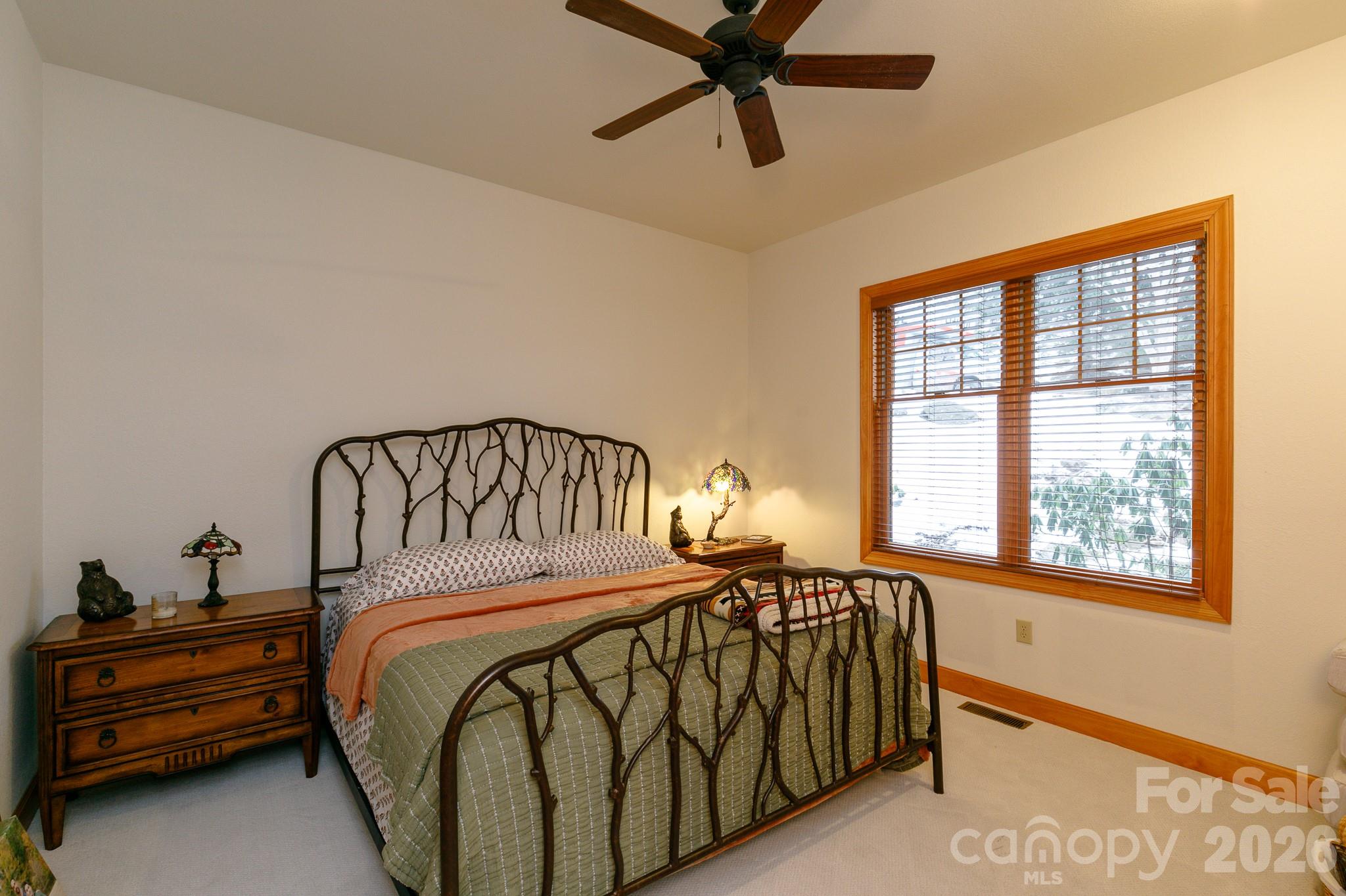 528 Andrew Banks Road, Unit A/3 Burnsville, NC 28714 - Photo 21 of 30 a bedroom with a bed and a window