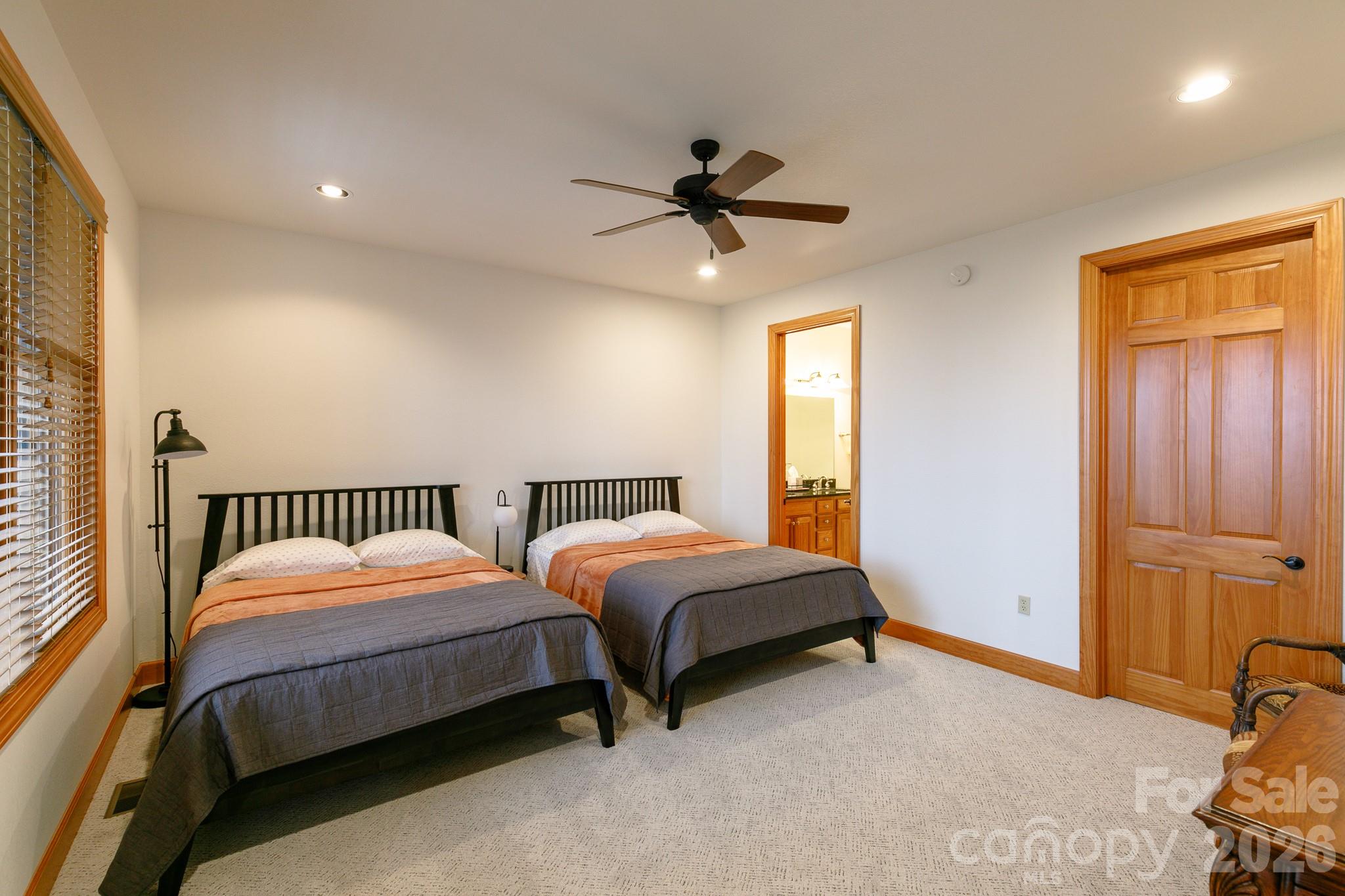 528 Andrew Banks Road, Unit A/3 Burnsville, NC 28714 - Photo 24 of 30 a bedroom with two beds and a window