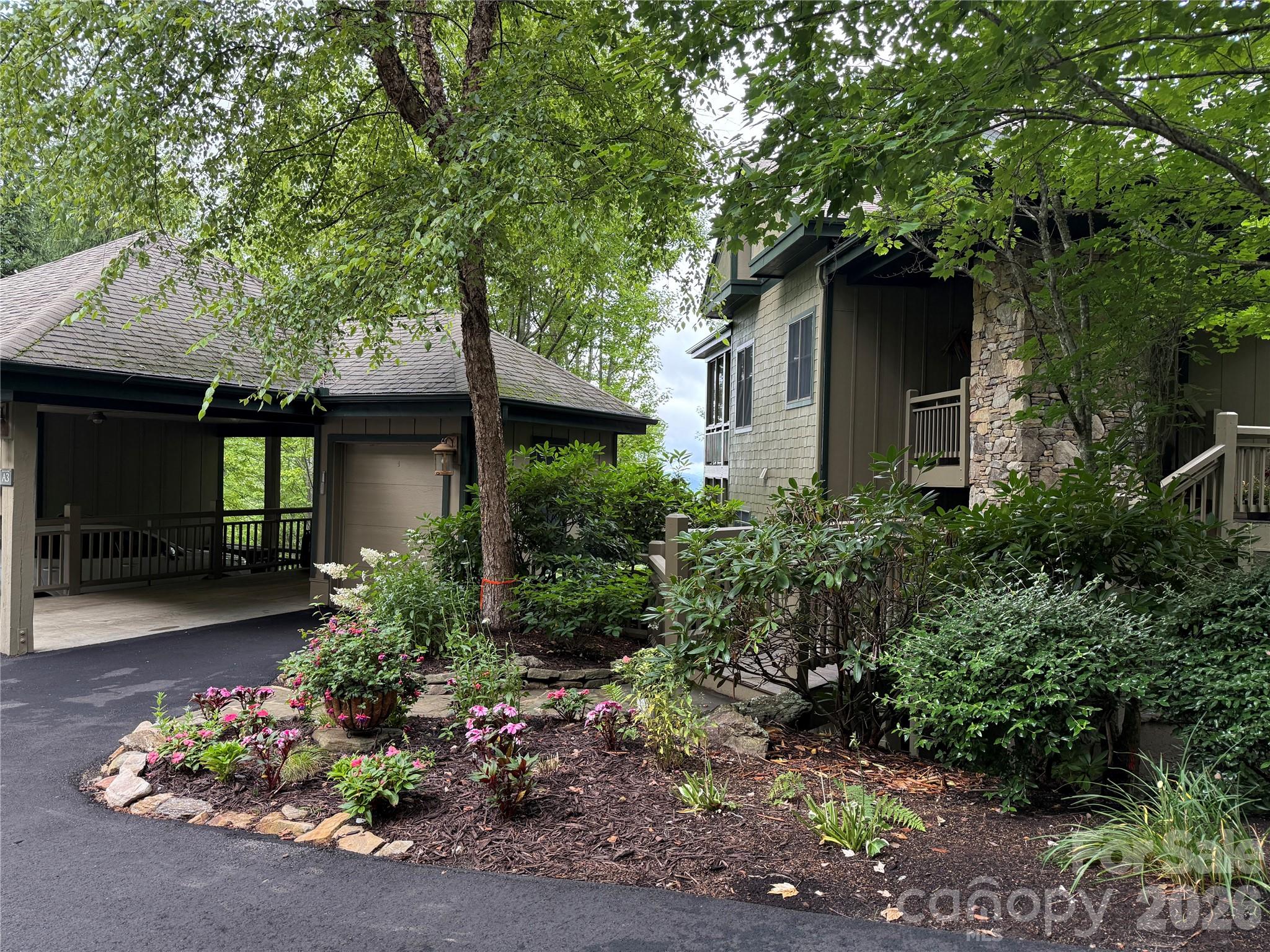 528 Andrew Banks Road, Unit A/3 Burnsville, NC 28714 - Photo 26 of 30 a front view of a house with a yard
