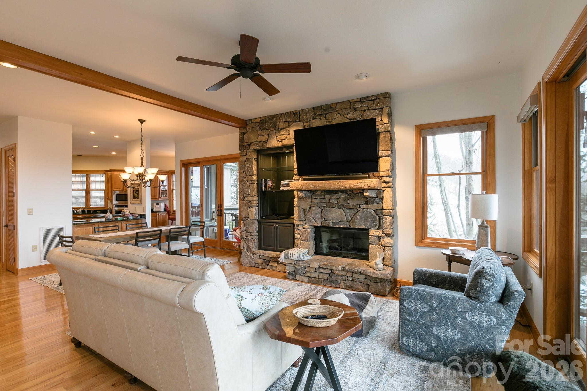 528 Andrew Banks Road, Unit A/3 Burnsville, NC 28714 - Photo 5 of 30 a living room with furniture fireplace and a flat screen tv