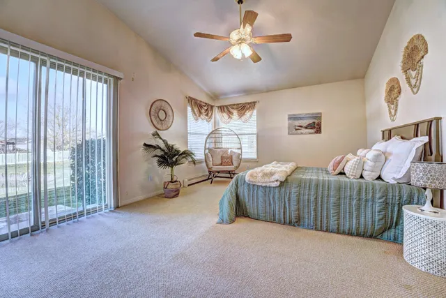 a bedroom with furniture and a chandelier