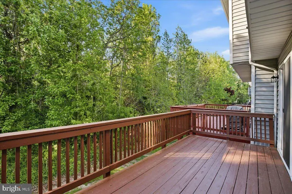 a view of balcony with wooden floor