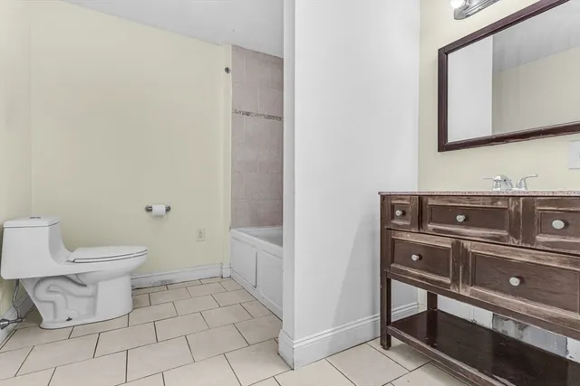 a bathroom with a toilet and a sink