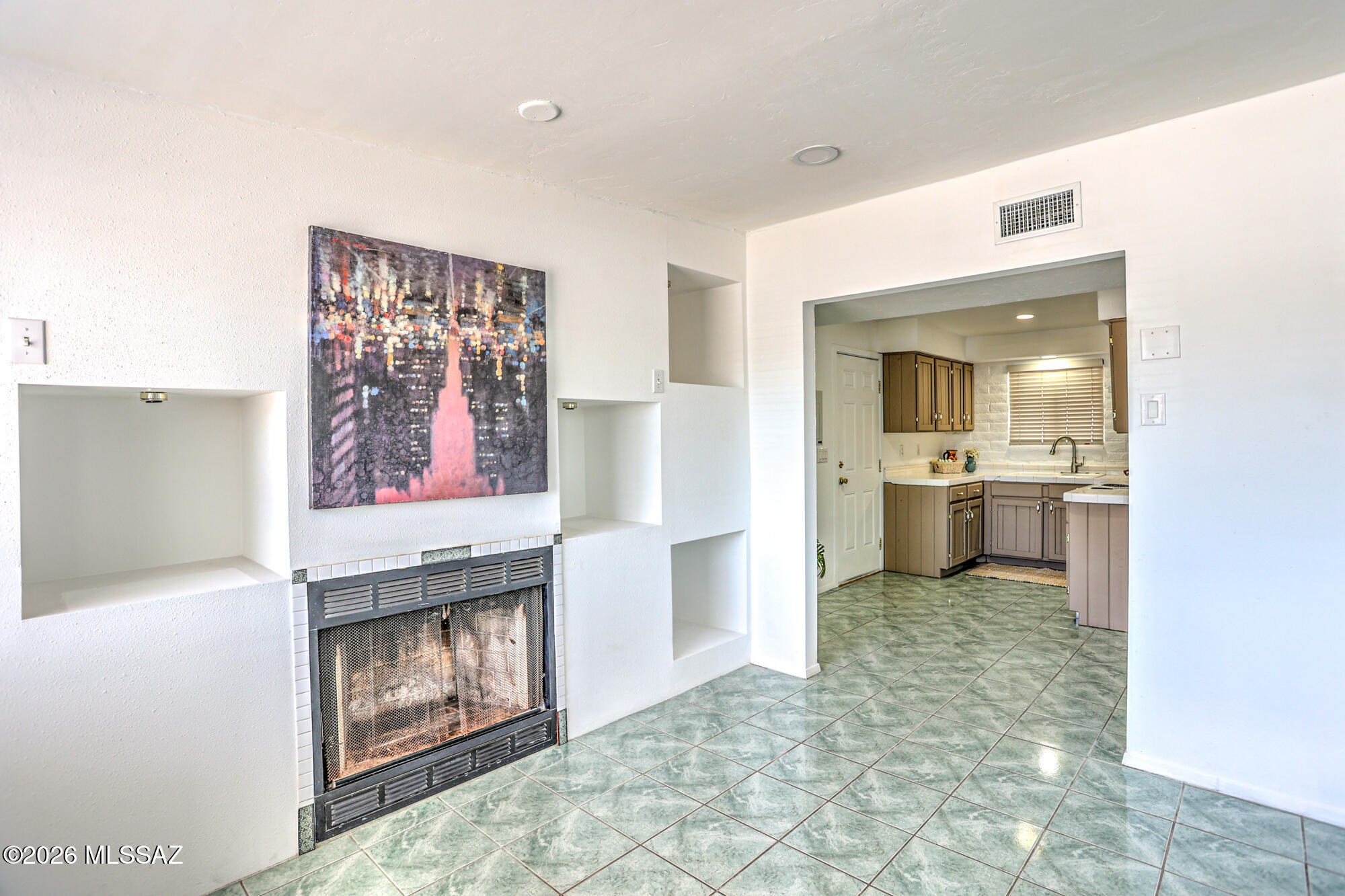 4400 West Ina Road Tucson, AZ 85741 - Photo 24 of 43 a living room with furniture and a fireplace