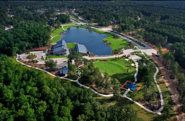an aerial view of house with yard swimming pool and outdoor seating