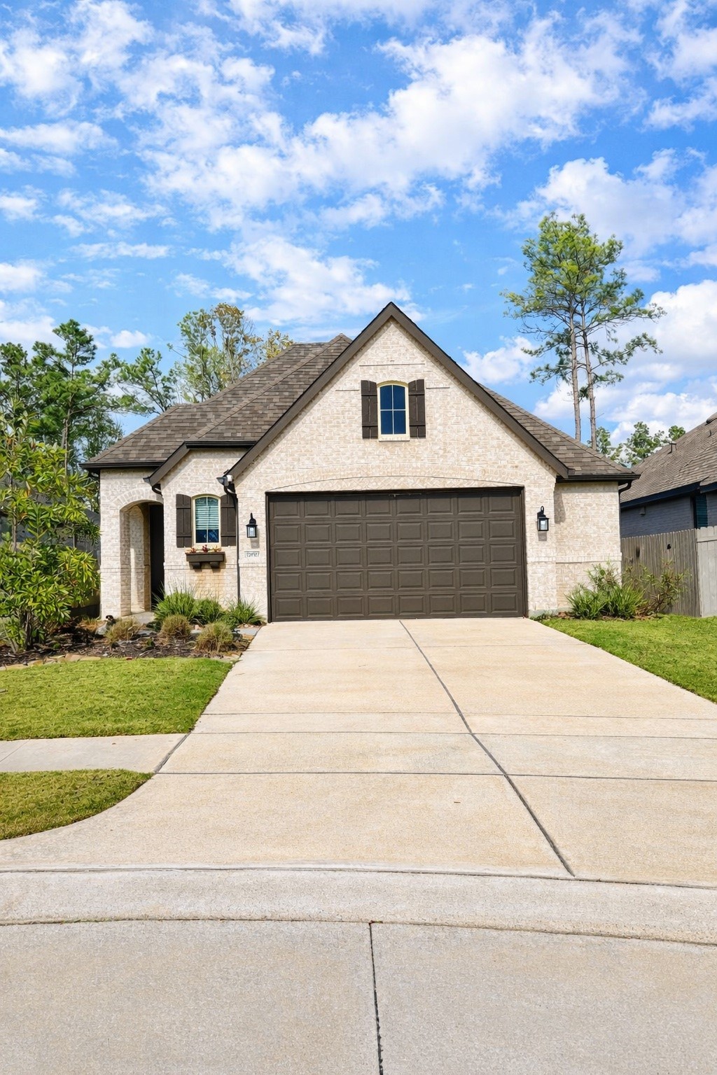 15907 Golden Trails Conroe, TX 77302 - Photo 7 of 17 a front view of a house with a yard and garage