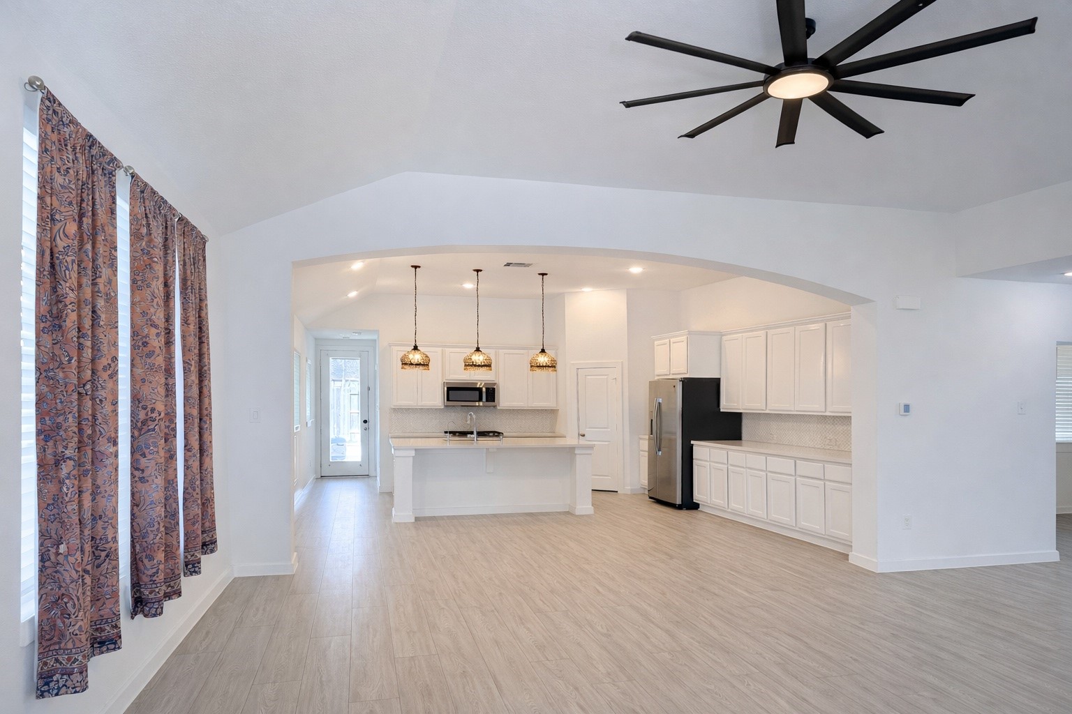 15907 Golden Trails Conroe, TX 77302 - Photo 9 of 17 a large kitchen with a lot of cabinets and wooden floor
