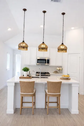 a dining room with furniture and window