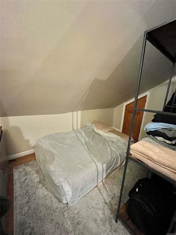 9 Clinton Street Poughkeepsie, NY 12601 - Photo 15 of 46 a bedroom with a bed and a stove