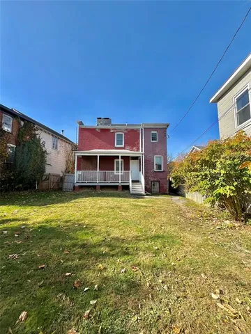 a view of water heater room with washer and dryer