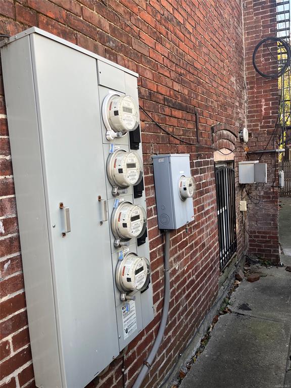 9 Clinton Street Poughkeepsie, NY 12601 - Photo 41 of 46 a view of water heater room with washer and dryer