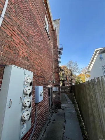 a view of house with a yard