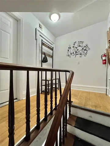 a view of a porch with wooden floor and furniture