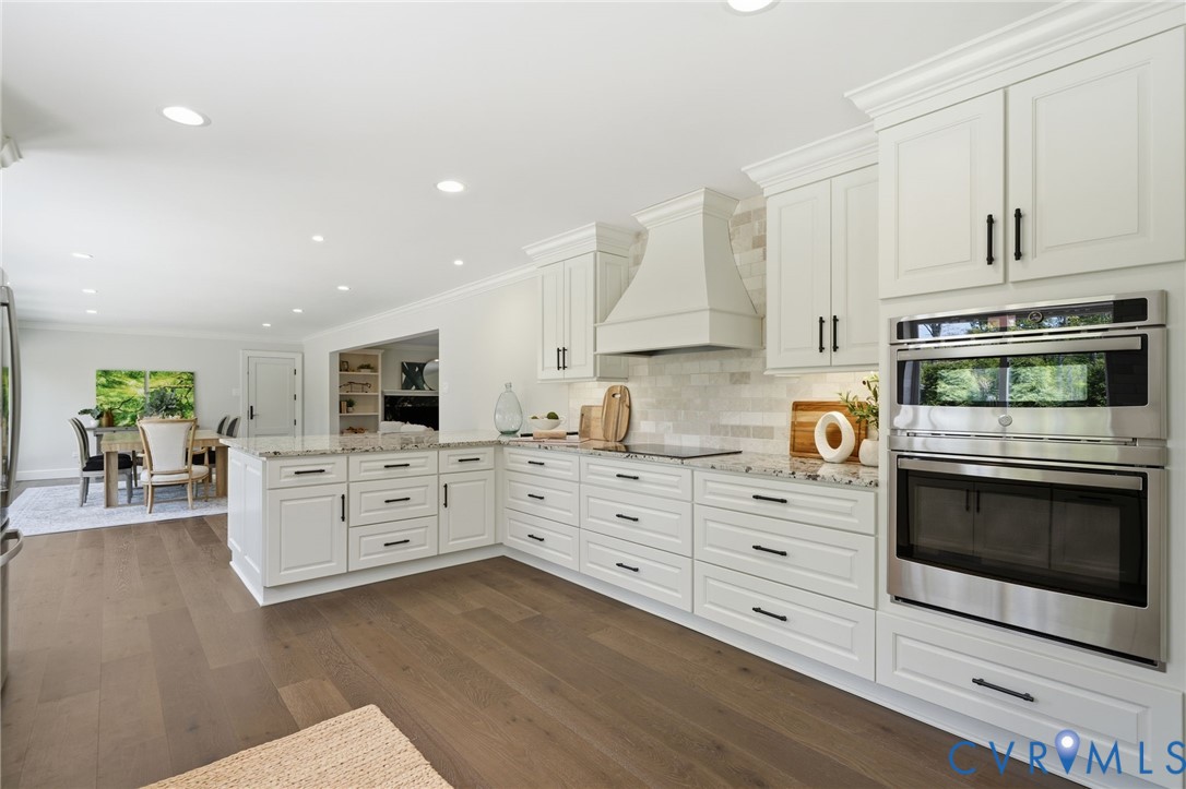 2540 Kentford Road Midlothian, VA 23113 - Photo 12 of 47 a kitchen with stainless steel appliances white cabinets and a stove top oven