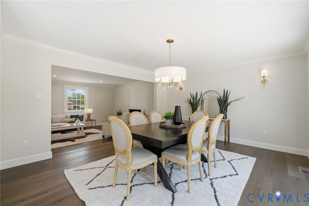 2540 Kentford Road Midlothian, VA 23113 - Photo 23 of 47 a view of a dining room with furniture wooden floor and chandelier