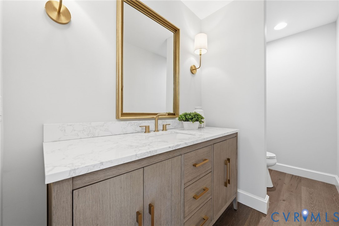 2540 Kentford Road Midlothian, VA 23113 - Photo 27 of 47 a bathroom with a granite countertop sink and a mirror