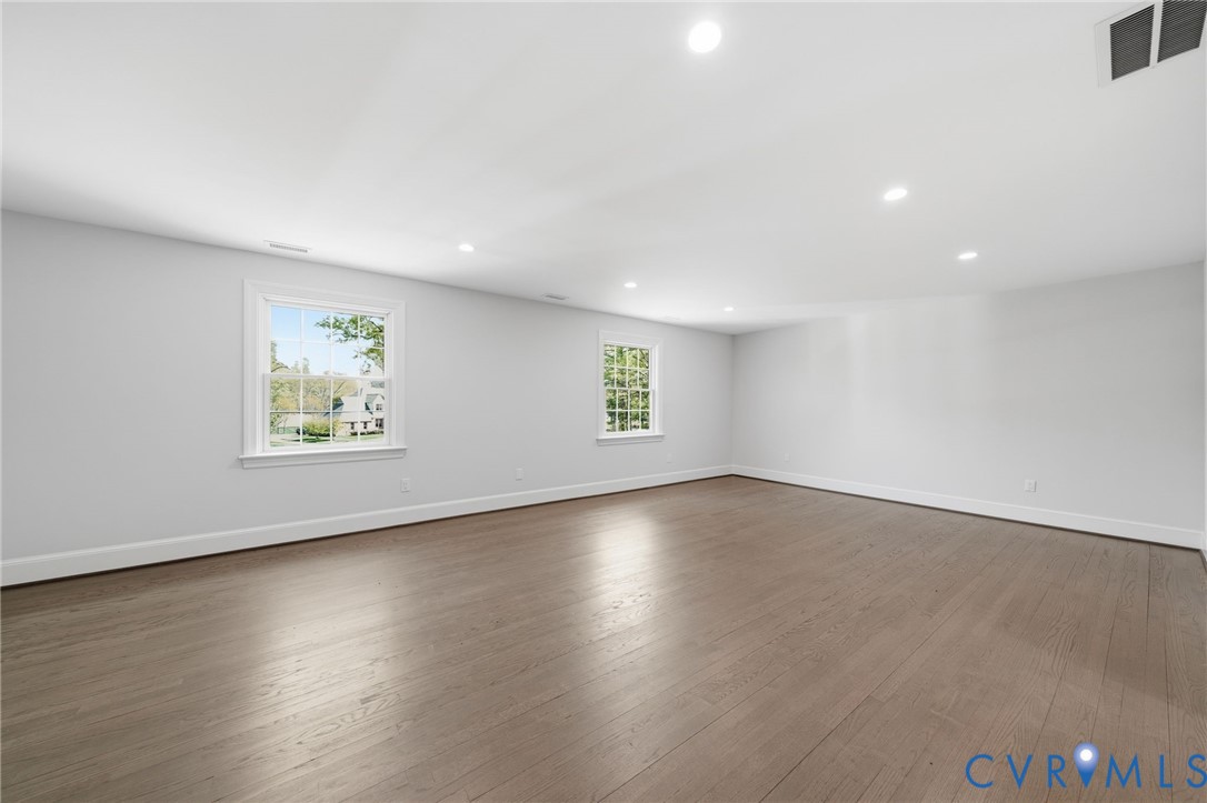 2540 Kentford Road Midlothian, VA 23113 - Photo 29 of 47 an empty room with wooden floor and windows