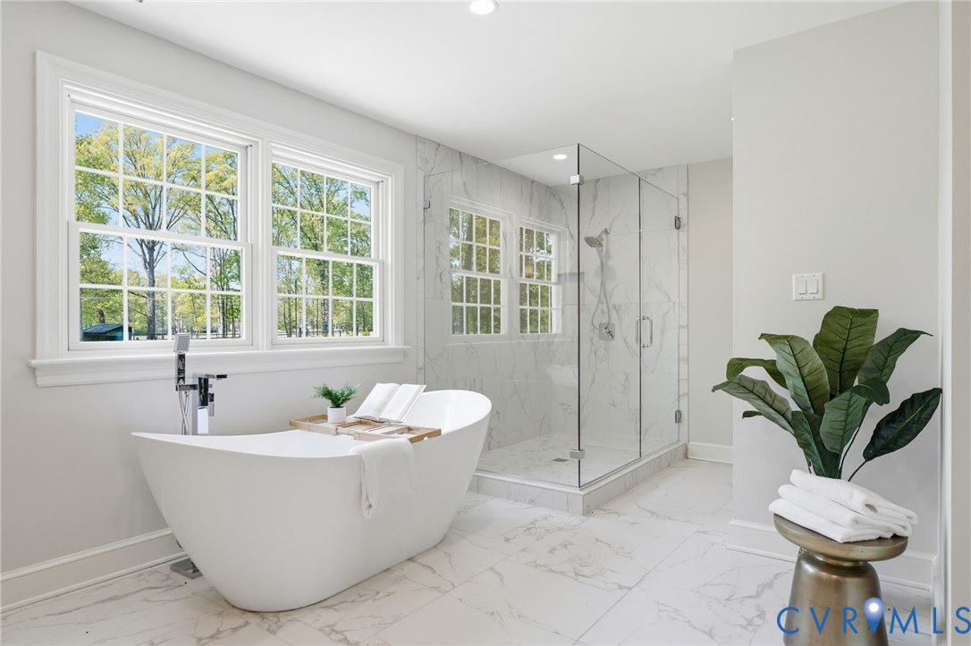 2540 Kentford Road Midlothian, VA 23113 - Photo 32 of 47 a white bath tub sitting in a bathroom next to a window