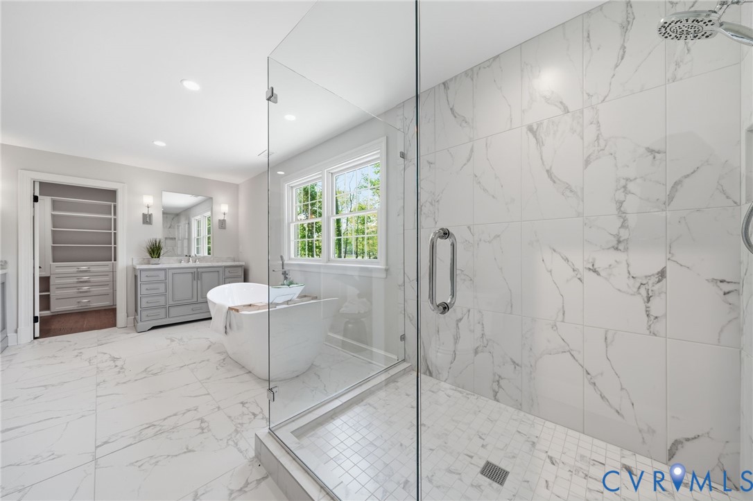 2540 Kentford Road Midlothian, VA 23113 - Photo 33 of 47 a bathroom with a granite countertop sink a mirror and shower