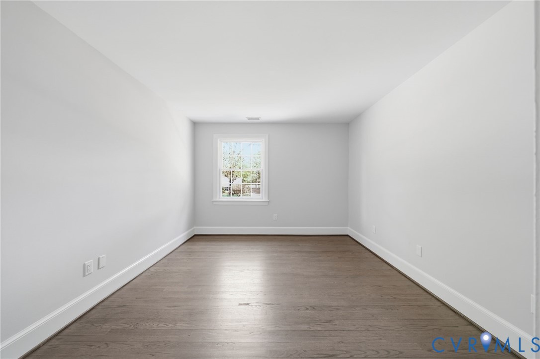 2540 Kentford Road Midlothian, VA 23113 - Photo 35 of 47 an empty room with wooden floor and windows