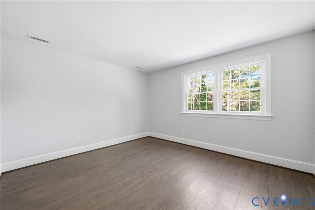 2540 Kentford Road Midlothian, VA 23113 - Photo 36 of 47 an empty room with wooden floor and windows