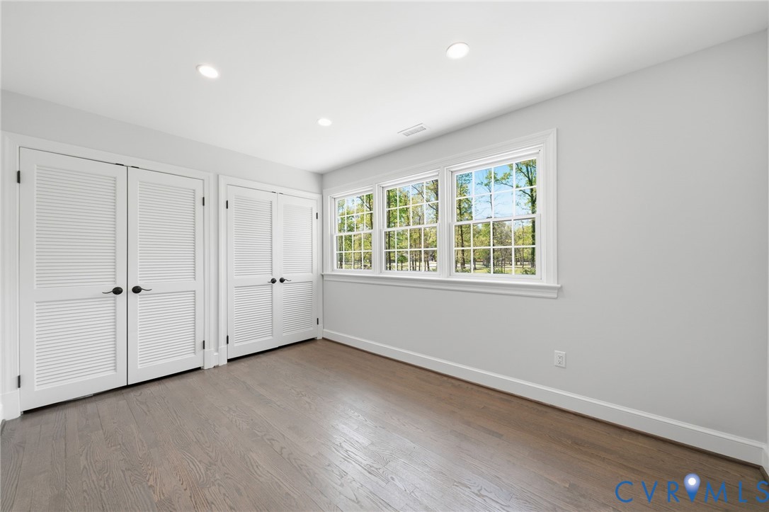 2540 Kentford Road Midlothian, VA 23113 - Photo 39 of 47 a view of an empty room with wooden floor and a window