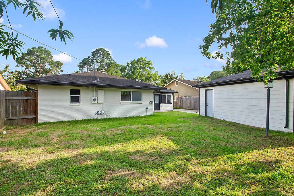 6106 Rutherglenn Drive Houston, TX 77096 - Photo 40 of 41 Expansive fully fenced backyard offering generous green space for recreation and entertaining.