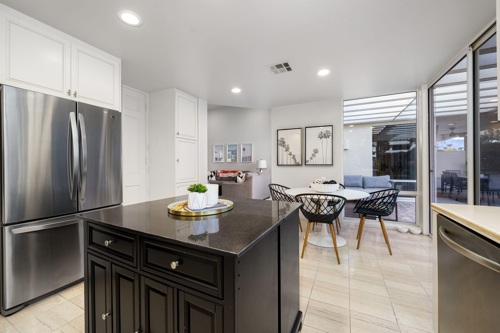 75720 Vista Del Rey Indian Wells, CA 92210 - Photo 14 of 31 a dining hall with stainless steel appliances granite countertop a dining table and chairs