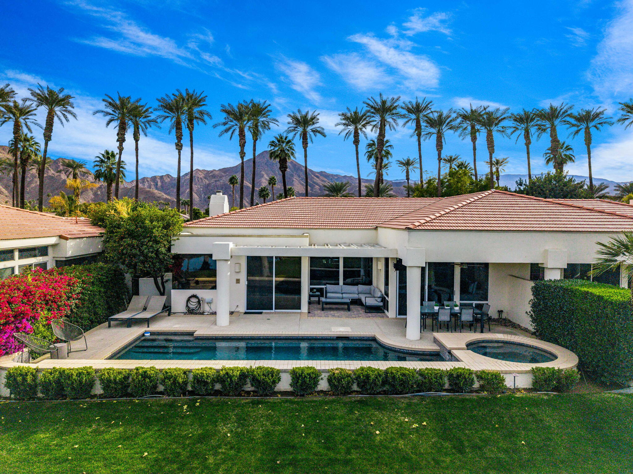 75720 Vista Del Rey Indian Wells, CA 92210 - Photo 25 of 31 a front view of a house with a yard table and chairs