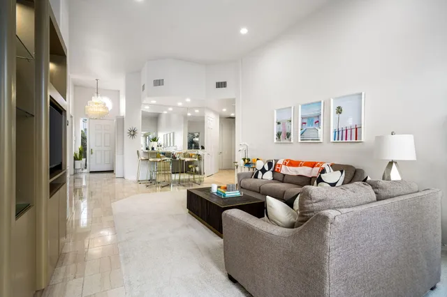 a living room with furniture and a table