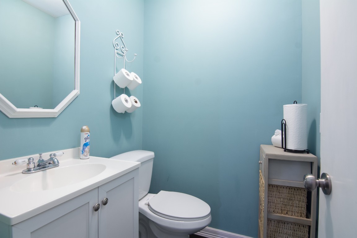 150 Edgewater Way Point Blank, TX 77364 - Photo 11 of 48 a bathroom with a sink a toilet and a mirror